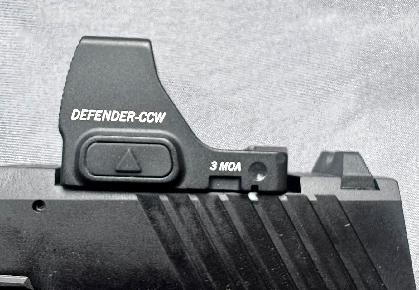 Close-up of the Vortex Defender-CCW housing showing the model markings on the side of the optic.